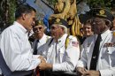 Republican presidential candidate, former Massachusetts Gov. Mitt Romney greets a group of veterans after speaking at a campaign event, Tuesday, May 29, 2012, in Craig, Colo. (AP Photo/Mary Altaffer)