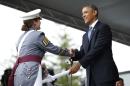 U.S. President Obama hands a diploma to a graduate during a commencement ceremony at the United States Military Academy at West Point