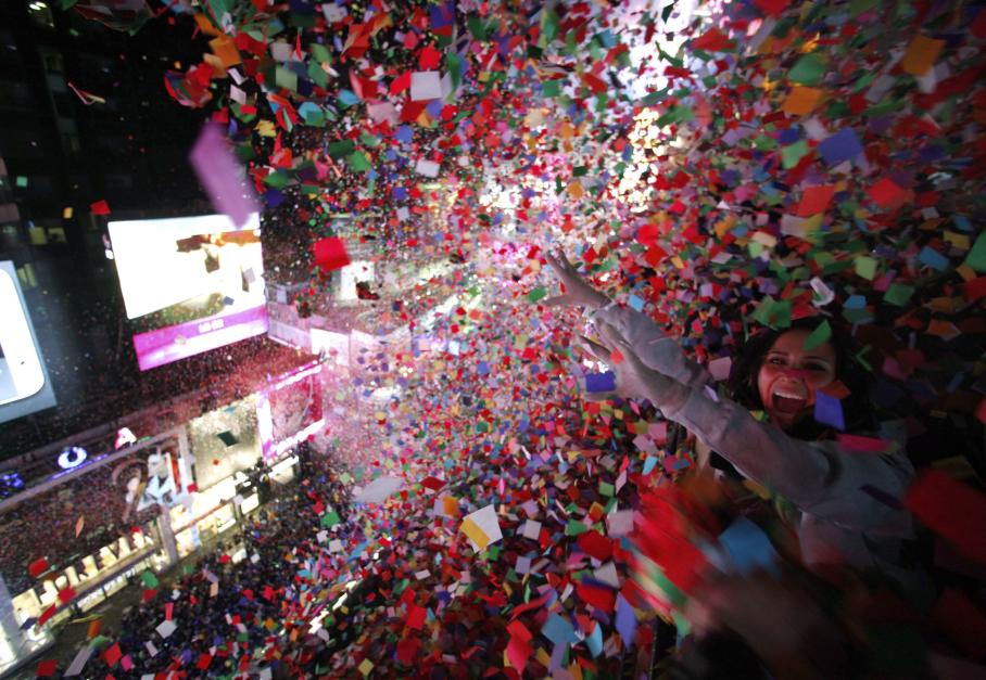 Confetti is dropped on revelers at midnight during New Year's Eve celebrations in Times Square in New York