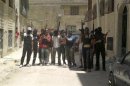 Syrian rebel fighters pose for a picture in Hama