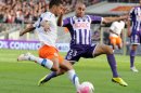 Toulouse's defender Aymen Abdennour (R) clashes with Montpellier's midfielder Younes Belhanda