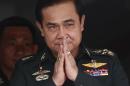 Thailand's newly appointed Prime Minister Prayuth Chan-ocha gestures in a traditional greeting during his visit to the 2nd Infantry Battalion, 21st Infantry Regiment, Queen's Guard in Chonburi province