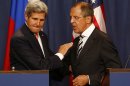 U.S. Secretary of State Kerry and Russian Foreign Minister Lavrov shake hands after making statements following meetings regarding Syria, at a news conference in Geneva