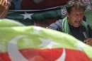 Khan, Pakistani cricketer-turned-politician and chairman of political party PTI, addresses his supporters during an election campaign in Karachi