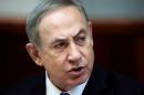 Israeli Prime Minister Benjamin Netanyahu opens the weekly cabinet meeting at his Jerusalem office