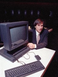 FILE - In this Sept. 18, 1990, file photo, Steve Jobs, president and CEO of NeXT Computer Inc., shows off his company's new NeXTstation after an introduction to the public in San Francisco. Apple on Wednesday, Oct. 5, 2011 said Jobs has died. He was 56. (AP Photo/Eric Risberg, File)