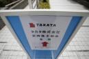 A sign board of Japanese auto parts maker Takata Corp's Annual General Meeting is seen on a street near the venue in Tokyo