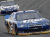 Brad Keselowski (2) leads Jimmie Johnson out of Turn 3 in the NASCAR Sprint Cup Series auto race Sunday, Aug. 7, 2011, in Long Pond, Pa. Keselowski won the race. (AP Photo/Mel Evans)