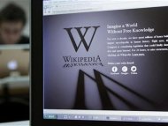A reporter's laptop shows the Wikipedia blacked out opening page in Brussels