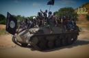 A screengrab taken on November 9, 2014 from a video released by the Nigerian Islamist extremist group Boko Haram and obtained by AFP shows Boko Haram fighters parading on a tank in an unidentified town