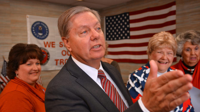 U.S. Sen Lindsey Graham speaks with supporters and volunteers during a campaign stop at the Spartanburg GOP women&#39;s group office, Wednesday, Oct. 29, 2014, in Spartanburg, S.C. (AP Photo/The Spartanburg Herald-Journal, Tim Kimzey)