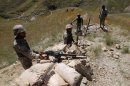 Afghan border policemen take their positions at Goshta