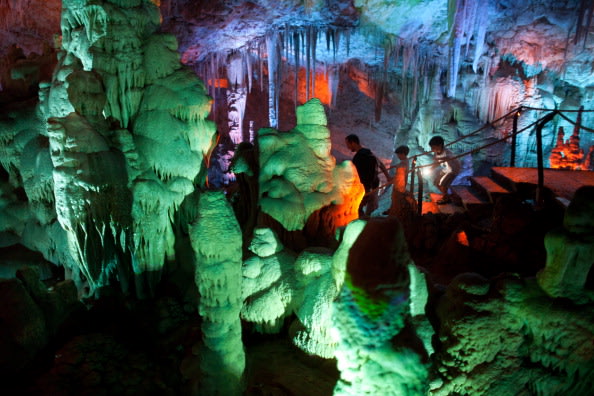 Visitors at the Sorek stalactites cave as it is illuminated with a new lighting system on August 9, 2012 near Beit Shemesh, Israel. The cave, 82 meters long and 60 meters wide, was discovered accident
