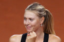 Russia's Maria Sharapova reacts after beating Czech Petra Kvitova 6-4, 7-6 during their semifinal match at the Porsche Tennis Grand Prix in Stuttgart, Germany, Saturday, April 28, 2012. (AP Photo/Michael Probst)