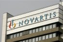 The logo of Swiss drugmaker Novartis is seen on the top of an office building at the company's plant in Basel