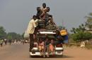 A car full with people and their belongings flee from Bangui on January 5, 2014