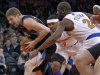 Timberwolves' Andrei Kirilenko reacts as he tries to get past Knicks' Carmelo Anthony and Raymond Felton during their NBA game in New York