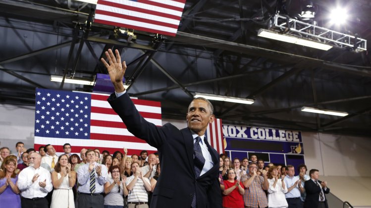 U.S. President Barack Obama waves after speaking about the economy in Illinois