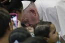 Pope Francis kisses a child on the forehead during his visit to the Federico Gomez Pediatric Hospital, in Mexico City, Sunday, Feb. 14, 2016. The pope makes a point of stopping at children's hospitals during his foreign trips, both to visit with the kids and to thank the staff for caring for them. (AP Photo/Gregorio Borgia)