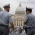 FILE - In this Tuesday, Sept. 21, 2010 file photo Italian financial Police officers talk, in front of St. Peter's square at the Vatican.    The Vatican is being besieged by near-daily leaks of confidential documents and tabloid-style reports about alleged money laundering at the Vatican bank, and in news reports Saturday Feb. 11, 2012, some conspiracy theorists highlight the upcoming crowning of 22 new cardinals, who will be partly responsible for electing the successor to the Pope himself. (AP Photo/Angelo Carconi, File)