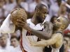 San Antonio Spurs guard Tony Parker (9) and Miami Heat forward LeBron James (6) collide during the second half of Game 6 of their NBA Finals basketball series, Tuesday, June 18, 2013 in Miami. (AP Photo/Lynne Sladky)