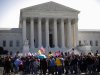 Supporters and opponents of health care reform rally in front of the Supreme Court in Washington, Tuesday, March 27, 2012, as the court continued arguments on the health care law signed by President Barack Obama. (AP Photo/Charles Dharapak)