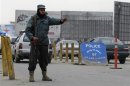 An Afghan policeman keeps watch at a check point in Kabul