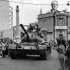 FILE- A Turkish army tank passes the Saray Hotel in the Turkish section of Nicosia, Cyprus, in this file photo dated July 24, 1974, as an image of Kemal Ataturk, founder of the modern Turkish republic looks down from a rooftop behind, as Turkey seized nearly 40 percent of the island and even more of its economic potential. After the 1974 invasion the people of Cyprus were forced to rebuild their lives and their economy from scratch, not something they Cypriot people ever wanted to to again, but following the 2013 collapse of the financial industry and the international financial bailout, even the most sanguine forecaster predicts many years of recession and sky-high unemployment. (AP Photo, File)
