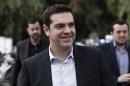 Opposition leader and head of radical leftist Syriza party Tsipras arrives for a meeting with journalists in Athens