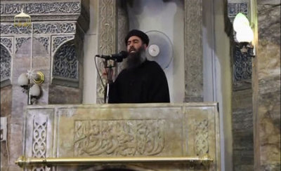 A man purported to be the reclusive leader of the militant Islamic State Abu Bakr al-Baghdadi from a video recording posted on the Internet on July 5, 2014, (REUTERS/Social Media Website via Reuters TV/Files)