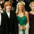 FILE - This Sunday May 30, 2004 file photo shows Daniel Radcliffe, left, who plays Harry Potter, Rupert Grint, second left, who plays Ron Weasley, and Emma Watson, right, who plays Hermione Granger, at the UK premiere of "Harry Potter and the Prisoner of Azkaban", with author J K Rowling, in London.  At last, Harry Potter's adventures are available electronically. The seven novels about J.K. Rowling's boy wizard are for sale as e-books and audio books on the author's Pottermore website, the site's creators announced  Tuesday March 27, 2012. The books are available only through the website, which says they are compatible with major electronic e-readers, including Amazon's Kindle and Sony's Reader, as well as with tablets and mobile phones. (AP Photo/John D McHugh, file)