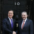 Britain's Prime Minister David Cameron, left, greets IOC President Jacques Rogge at Downing Street in London,  Wednesday, March 28, 2012. Cameron is meeting with International Olympic Committee President Jacques Rogge and officials, amid the final inspection visit before the games by the IOC coordination commission. (AP Photo/Kirsty Wigglesworth)