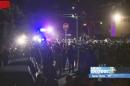 This video image provided by KEYT-TV shows a crowd confronting police at a disturbance Saturday April 5, 2014, during a weekend college party in Southern California that devolved into a street brawl. About 100 people were arrested and at least 44 people were taken to the hospital. (AP Photo/KEYT-TV)