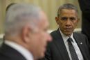 President Obama listens to Primie Minister Netanyahu