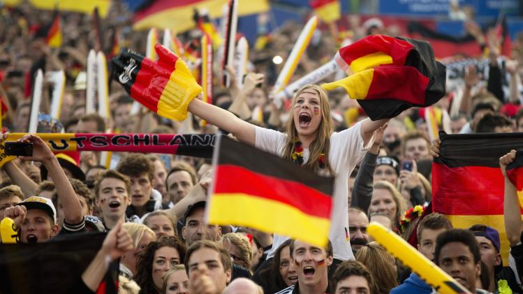 German soccer fans celebrate team during 2014 World Cup Group G soccer match between Germany and Ghana at public viewing zone called &#39;fan mile&#39; in Berlin