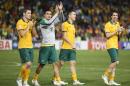 From left to right, Australia's Mathew Leckie, Tim Cahill, Jason Davidson and Robbie Kruse acknowledge the crowd after winning the AFC Asian Cup semifinal soccer match between Australia and United Arab Emirates in Newcastle, Australia, Tuesday, Jan. 27, 2015. (AP Photo/Rick Rycroft)