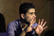 Fahd al-Bakoush, a freelance videographer, 22, discusses a video he shot that shows civilians removing the body of U.S. Ambassador Chris Stevens from a small dark room in the U.S. consulate in Benghazi in the aftermath of the Tuesday Sept. 11, 2012, attack, during an interview with the Associated Press, in Benghazi, Libya, Monday, Sept. 17, 2012. Stevens and three other Americans were killed in the attack on the consulate as part of a wave of assaults on U.S. diplomatic missions in Muslim countries over a low-budget movie made in the United States that denigrates the Prophet Muhammad. (AP Photo/Mohammad Hannon)