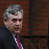 Former British Prime Minister Gordon Brown arrives to give evidence before the Leveson Inquiry into the ethics and practices of the media at the High Court in London