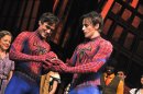 In this Sunday, Sept. 15, 2013 publicity photo, actor Justin Matthew Sargent, left, is symbolically handed Spider-Man’s mask from outgoing hero Reeve Carney onstage at the at the Foxwoods Theatre during the curtain call in New York. Carney left the show left after more than 840 performances and plenty of drama. . (AP/Jenny Anderson/Spider-Man: Turn Off The Dark)