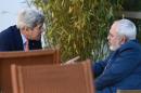 US Secretary of State John Kerry (L) talks with Iranian Foreign Minister Mohammad Javad Zarif on May 30, 2015 in Geneva