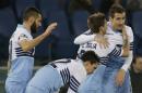 Lazio's Miroslav Klose, right, celebrates with teammates after scoring during a Serie A soccer match between Lazio and AC Milan in Rome's Olympic stadium, Saturday, Jan. 24, 2015. (AP Photo/Gregorio Borgia)