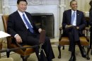 FILE - In this Feb. 14, 2012 file photo, U.S. President Barack Obama, right, meets with then Chinese Vice President Xi Jinping in the Oval Office of the White House in Washington. Obama and Xi, now Chinese president, face weighty issues when they meet at a private estate in California early June 2013, but their most important task may simply be establishing a strong rapport. (AP Photo/Susan Walsh, File)