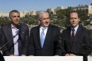 Israel's Prime Minister Netanyahu stands with Jerusalem Mayor Barkat and Communications Minister Kahlon in Jerusalem