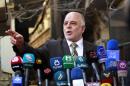 Iraqi Prime Minister Haider al-Abadi gives a press conference on October 20, 2014, in Najaf, Iraq