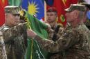 Commander of the International Security Assistance Force (ISAF), Gen. John Campbell, left, and Command Sgt. Maj. Delbert Byers open the 