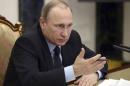 Russian President Vladimir Putin meets government members in Moscow