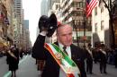 Former Irish prime minister Albert Reynolds (centre) raises his hat to the crowd as he parades during the St Patrick's day parade in New York on March 17, 1998