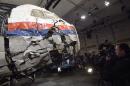 The wrecked cockpit of Malaysia Airlines flight MH17 is presented to the press during a presentation of the final report on the cause of the its crash, at the Gilze Rijen airbase October 13, 2015