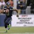 Seahawks quarterback Wilson runs for a gain against the Packers during the second quarter of their Monday night NFL football game at Centurylink Field in Seattle
