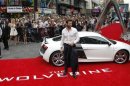 Actor Hugh Jackman poses at the UK Premiere of The Wolverine at Leicester Square in London